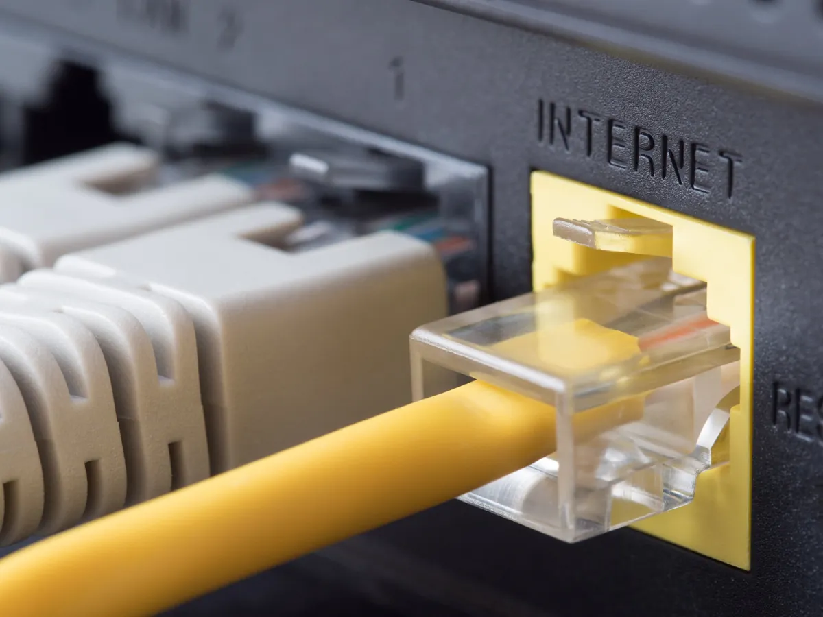 An ethernet cable plugged into a router